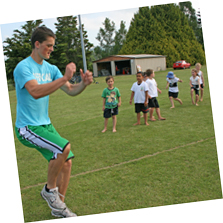 Senior athlete coaching juniors in High Jump
